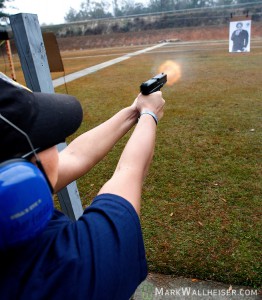 TPD recruit Maria Martinez fires at a moving target during firearms training at the Pat Thomas Law Enforcement Academy January 09, 2007. (Mark Wallheiser/TallahasseeStock.com)